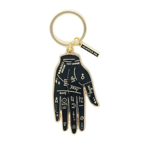 black hand shaped keychain with astrology signs in gold