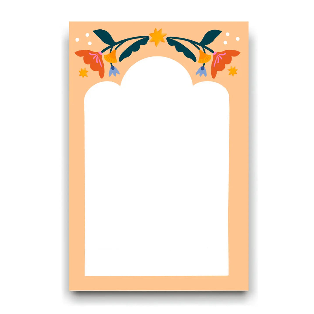A peach-colored notepad with a white writing area, decorated with colorful floral illustrations and star accents across the top.