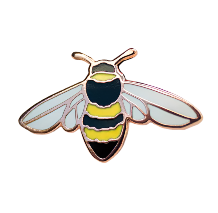 A gold-accented enamel pin shaped like a honey bee, featuring black and yellow stripes on the body and translucent white wings.