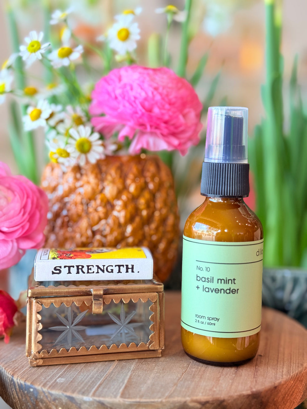Photo of basil mint & lavender room spray, glass trinket box, & strength tarot card matches