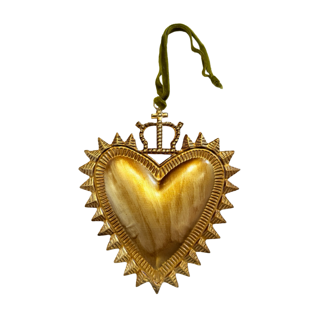 Gold ornament with embossed heart design topped with a crown also featuring a green velvet loop for hanging