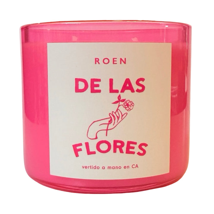 Photo of pink candle jar with branded label that reads "Roen - De Las Flores - Vertido a mano en CA"