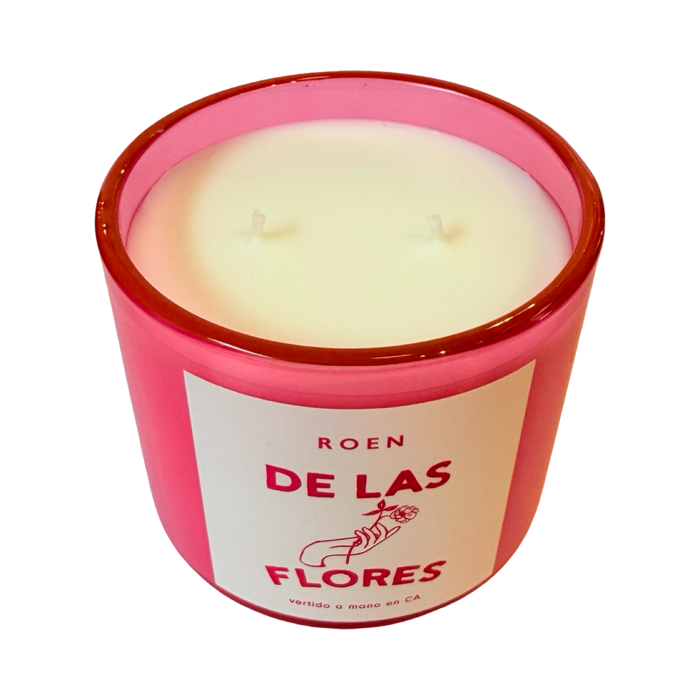 Top view of pink candle jar with branded label that reads "Roen - De Las Flores - Vertido a mano en CA"