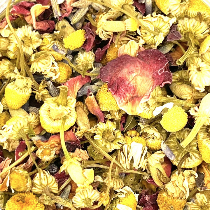 close up view of dried rose petals, peppermint, chamomile and lavender. Brand: Loveyenergy & Blessings