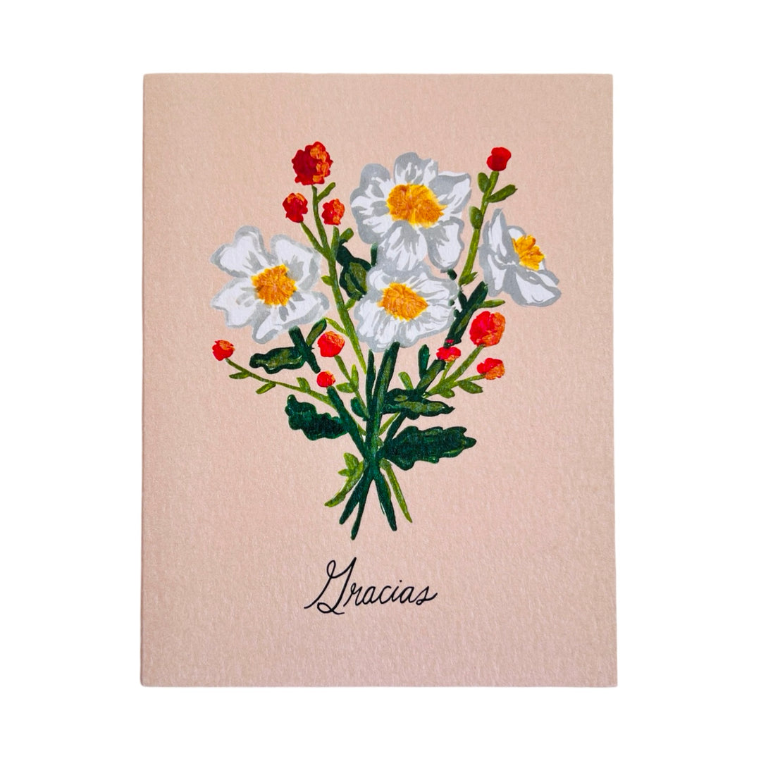 blush greeting card with an illustration of a bouquet of Matilija Poppies and the phrase Gracias in black lettering.