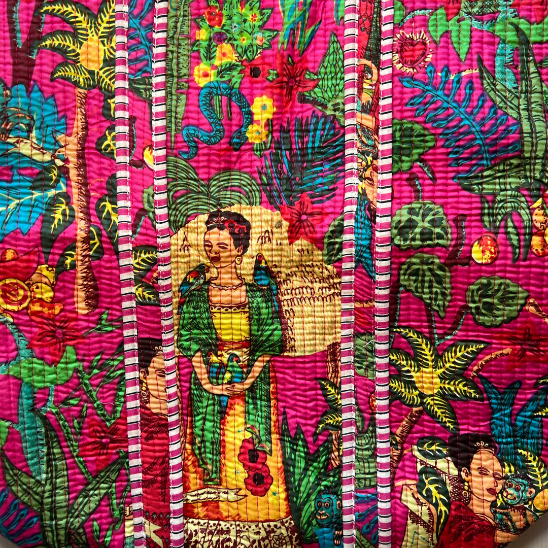 close up view of a Vibrant woven tote bag featuring colorful depictions of traditional Mexican art, adorned with floral and cultural motifs.