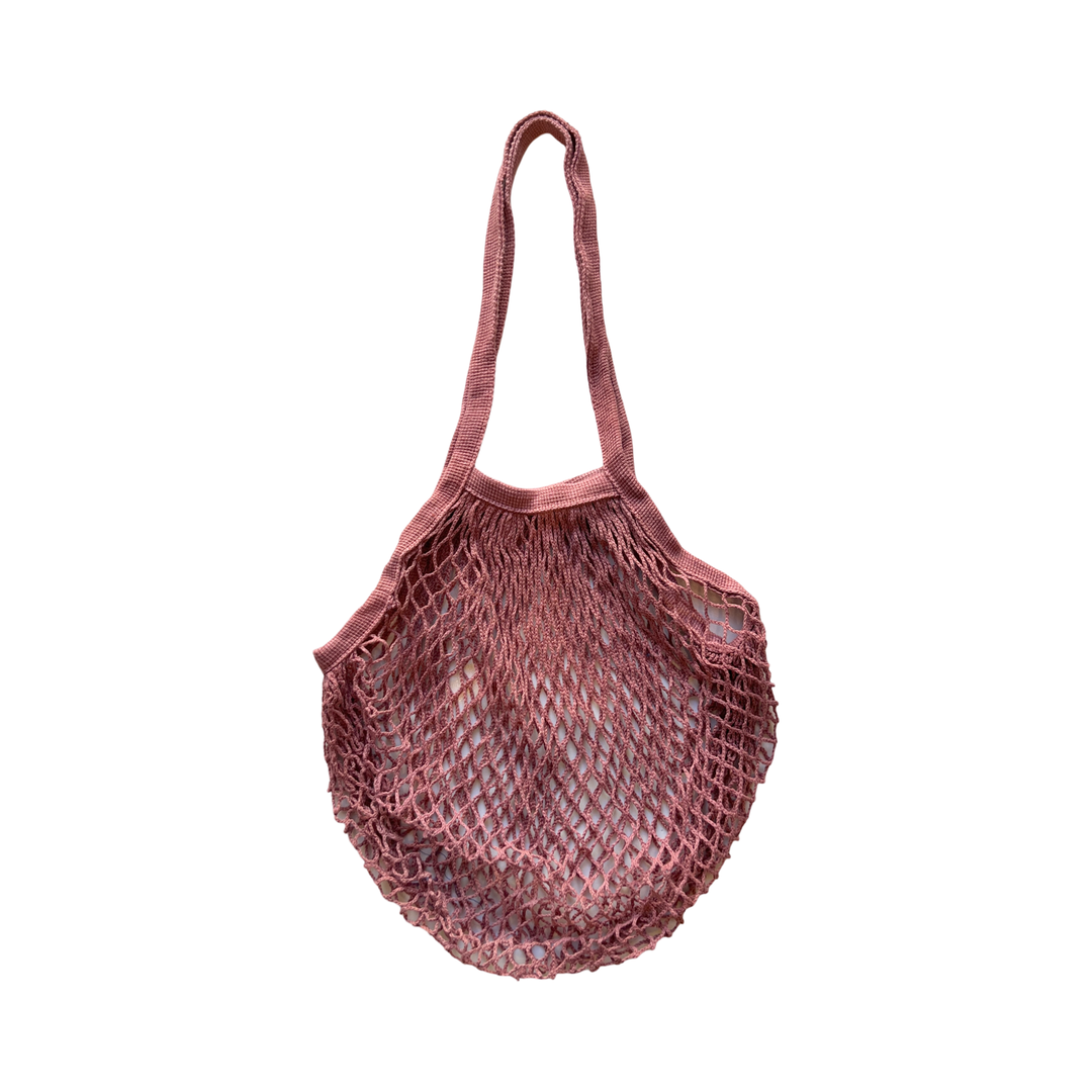 blush cotton mesh French Market Bag with sturdy handles, designed for carrying groceries, produce, and everyday essentials in an eco-friendly way