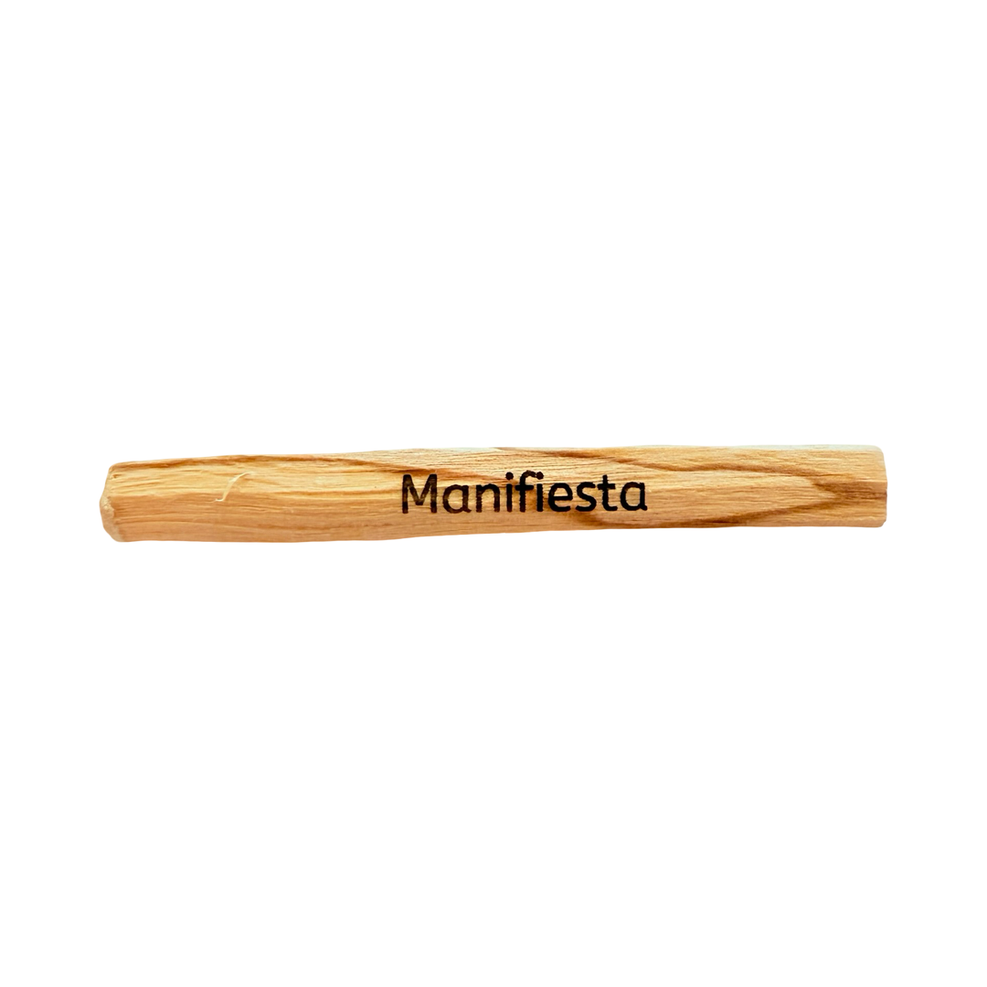 palo santo stick engraved with the word manifesta -manifest