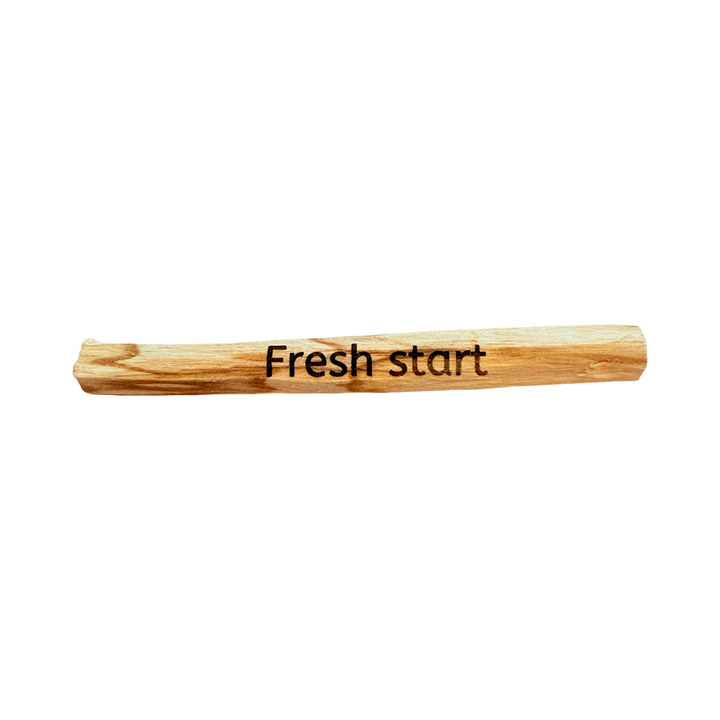 palo santo stick engraved with the phrase Fresh Start.