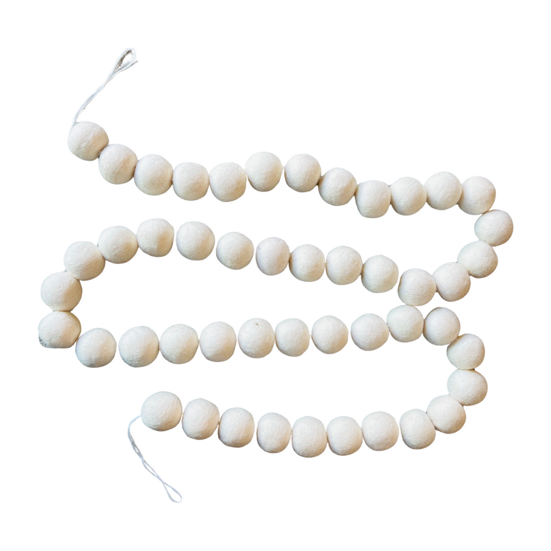 garland of white felt pom poms