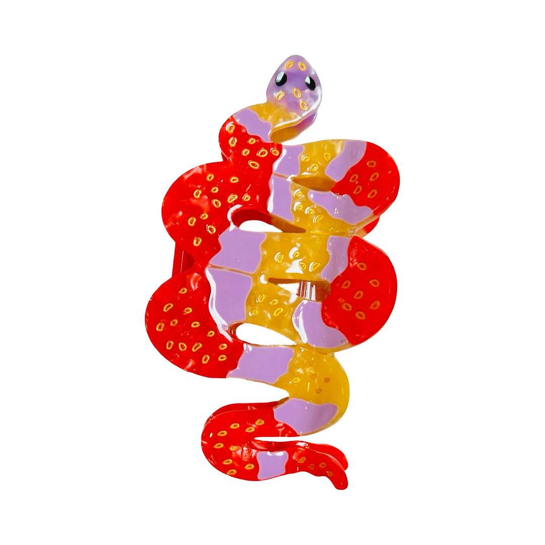 orange, pink and red patterns with golden accents hand painted snake hair claw clip.
