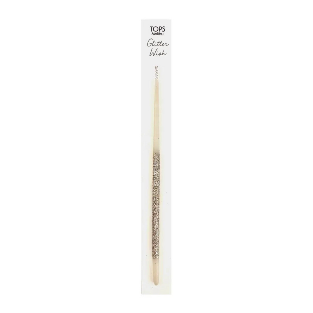 white candle with silver glitter at the end packaged in a white branded backing.