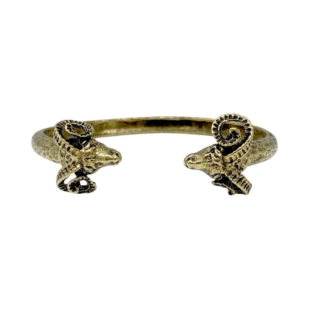 gold cuff bracelet with rams on each end