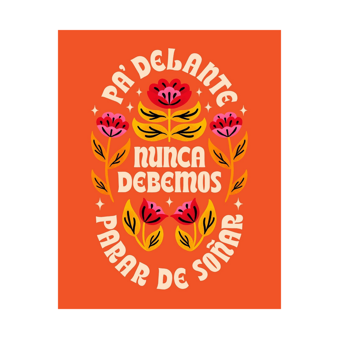 Orange card with illustrations of pink and red flowers with oranges leaves featuring the phrase Pa'Delante Nunca Debemos Parar de Soñar in cream lettering.