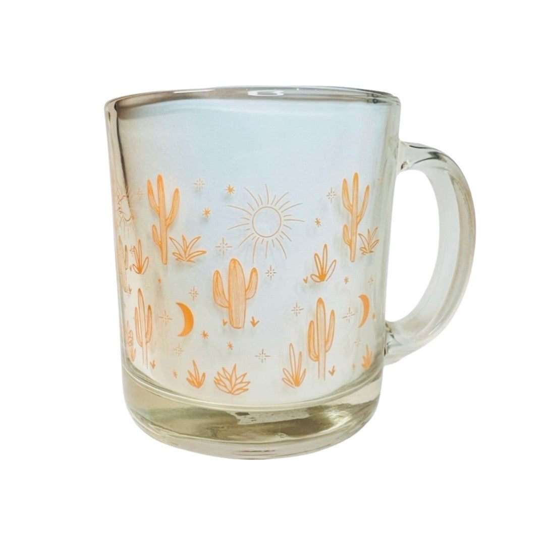 clear glass mug featuring an orange cacti and design