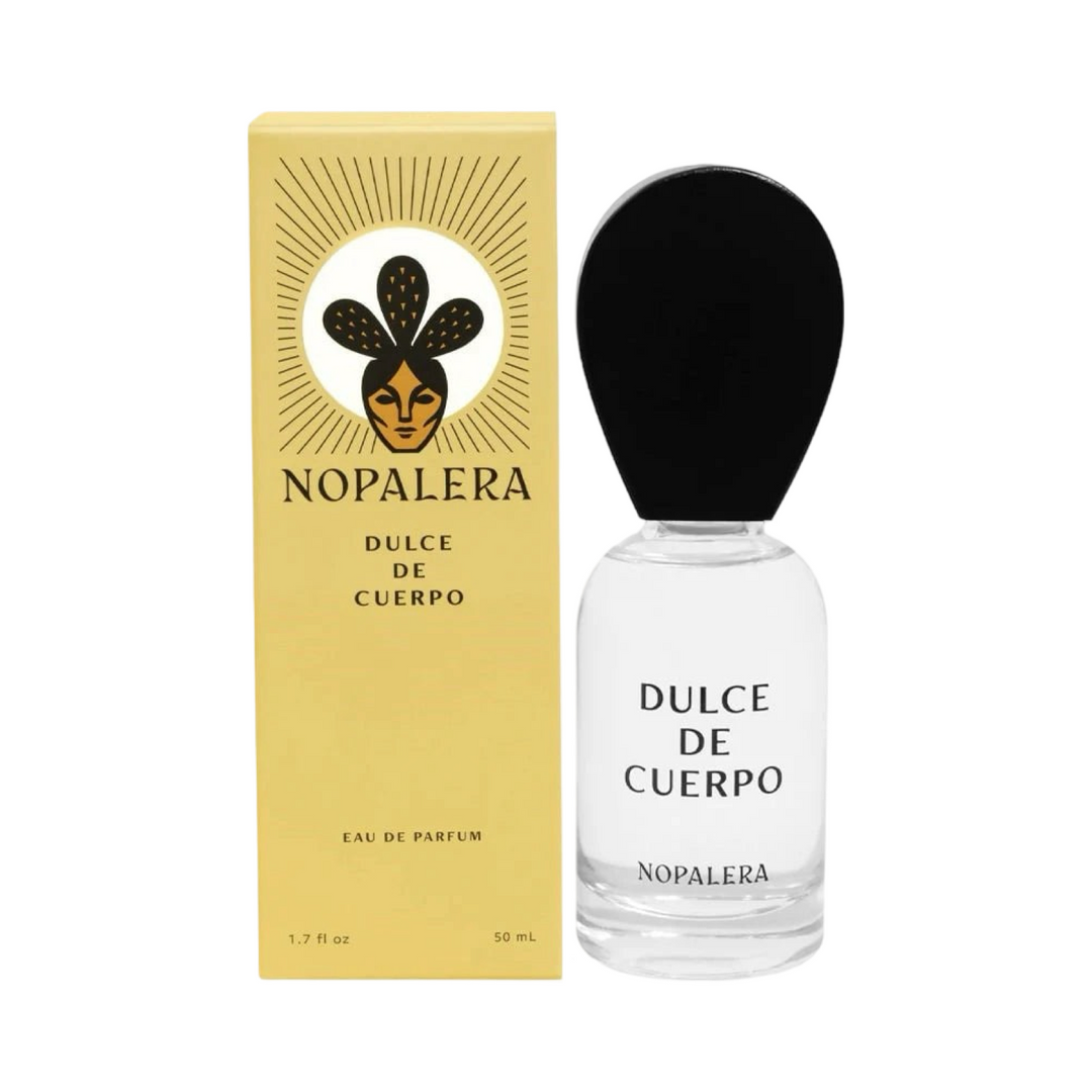 clear 50ml jar with a black top flanked by a yellow branded box of Dulce De Cuerpo Nopalera perfume