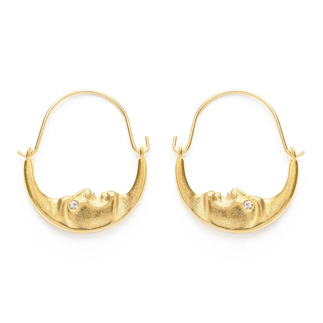 Gold crescent moon hoop earrings with sculpted moon faces and small crystal accents at the eyes.