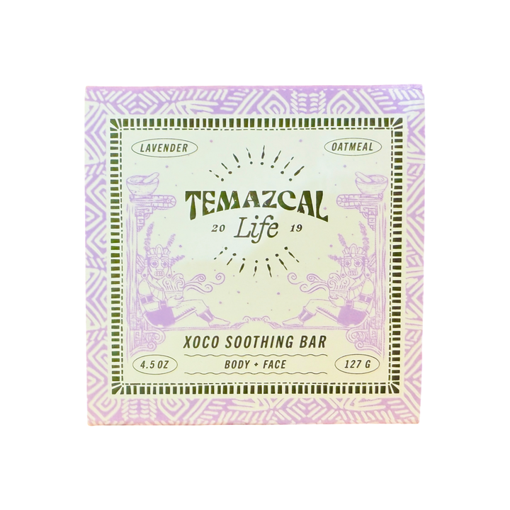 Close-up of the Temazcal Life Xoco Soothing Bar box featuring lavender and oatmeal, with intricate purple Aztec-inspired patterns and detailed illustrations surrounding the brand name.