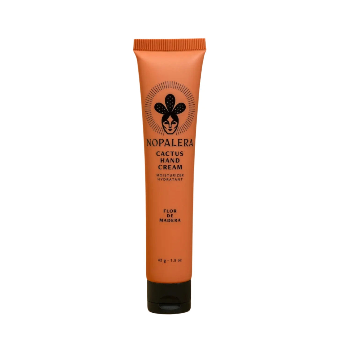 1.5 oz orange tube with black lid of cactus cream featuring an image of a woman wearing a cactus crown. Brand: Nopalera
