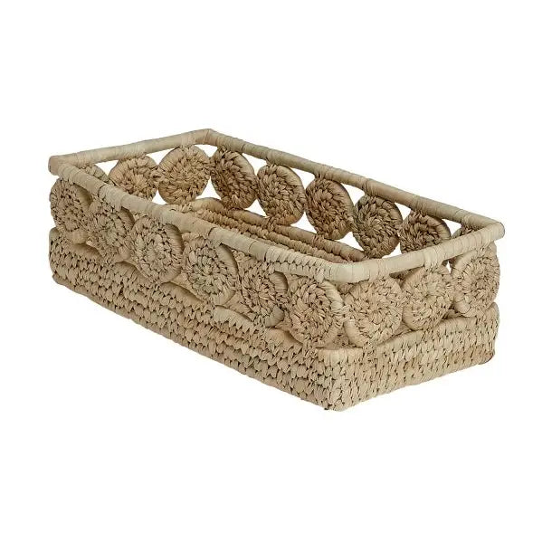 Angled view of a rectangular palm fiber bread basket featuring woven medallion details and an open weave design along the top edge.