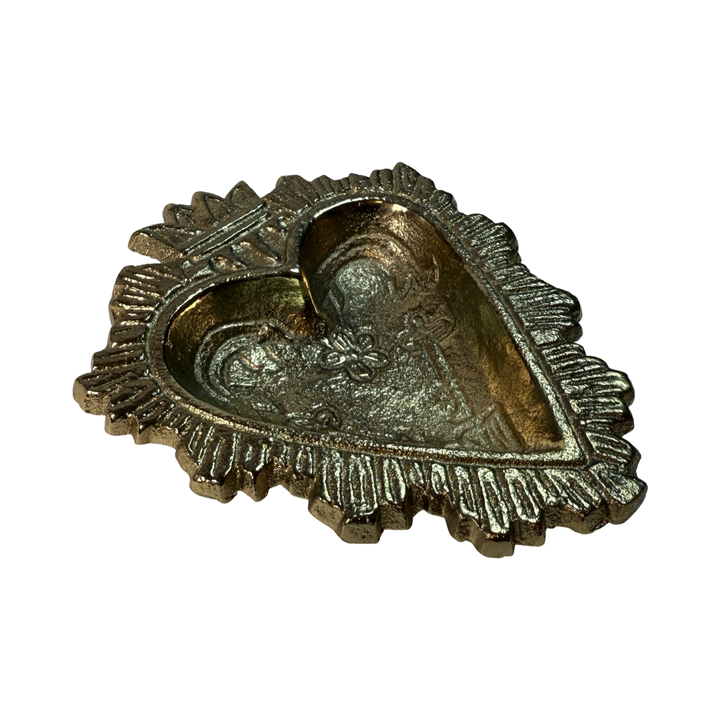 Brass ring bowl shaped like a heart with embossed floral and sacred heart details.