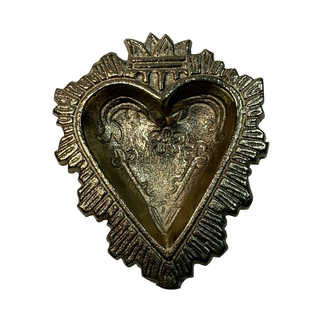 Top view of a Brass ring bowl shaped like a heart with embossed floral and sacred heart details.