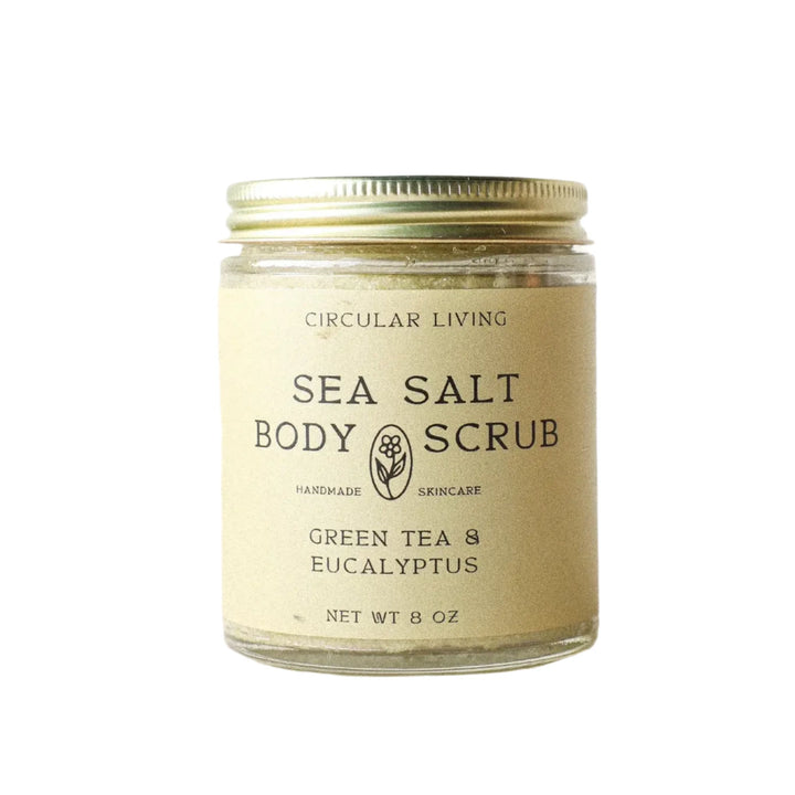Photo of 8 oz clear glass jar with beige branded label for Sea Salt Body Scrub
