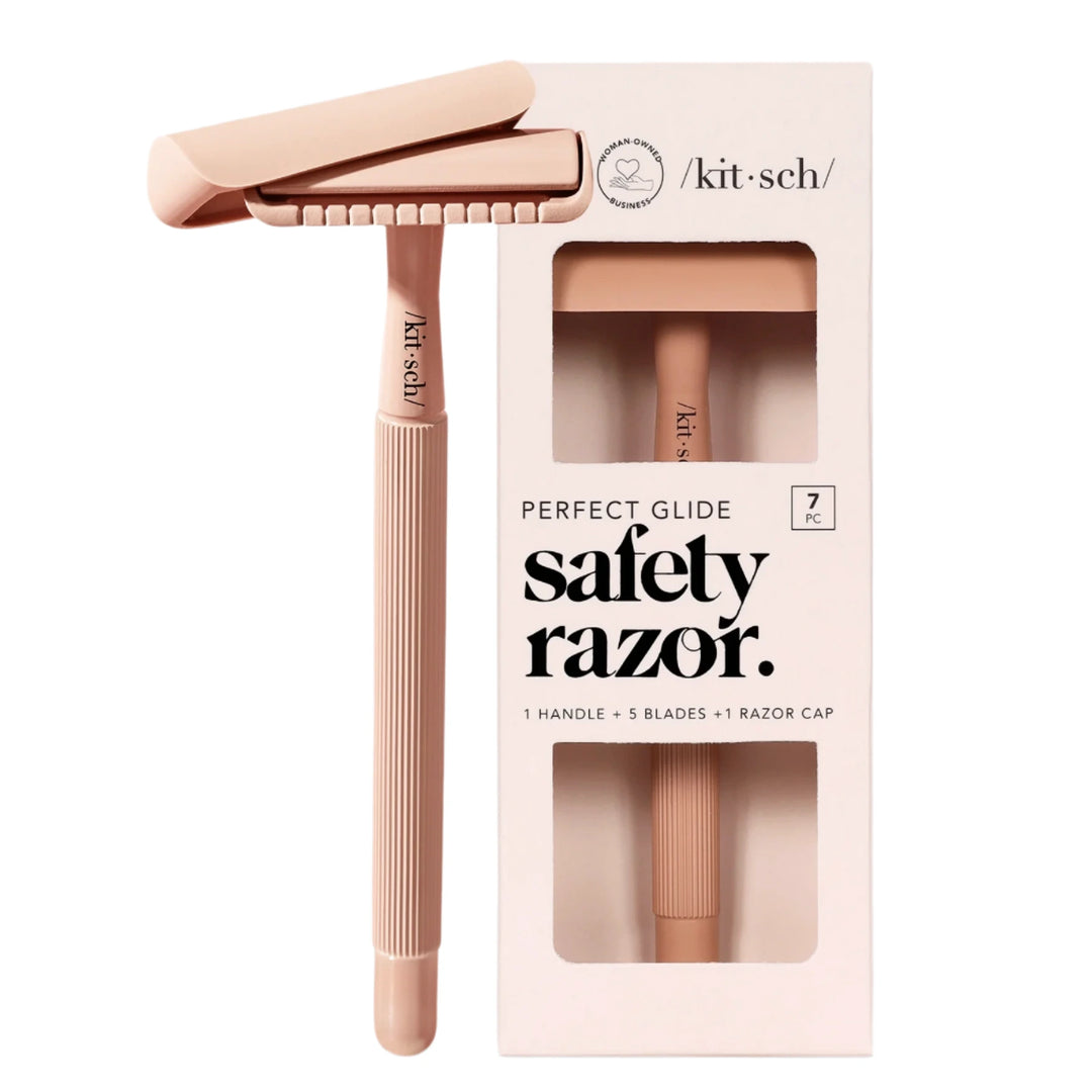 Terracotta-colored Kitsch safety razor shown next to its packaging, labeled “Perfect Glide Safety Razor” with details of 1 handle, 5 blades, and 1 razor cap included.