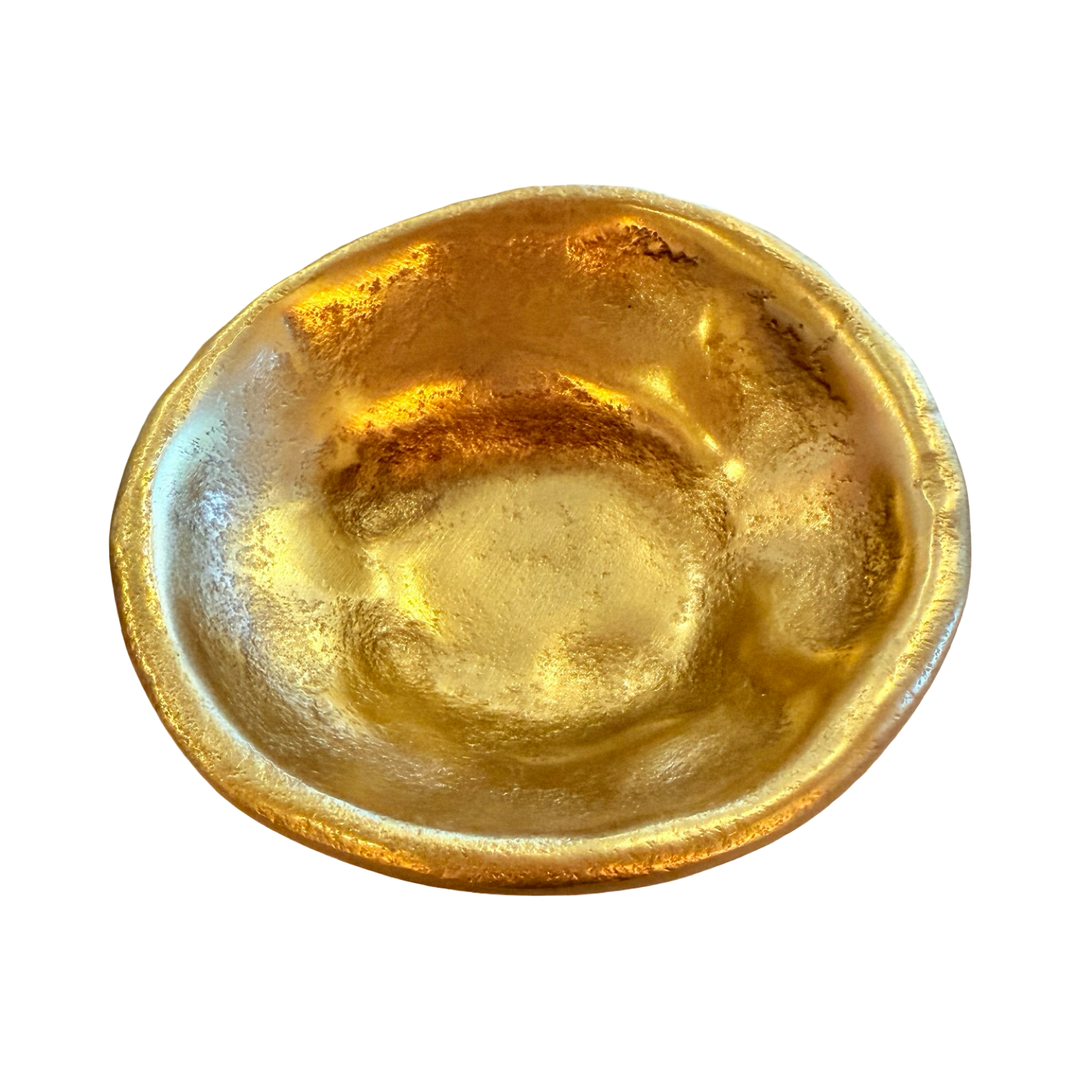 top view of a Free-form dish made of textured gold aluminum with an irregular, organic shape.