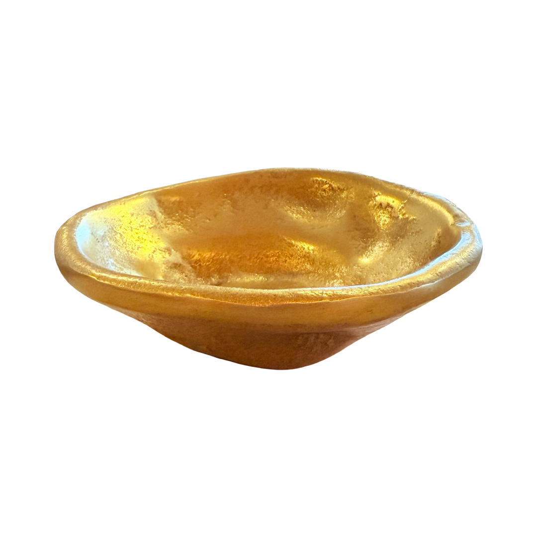 side view of a Free-form dish made of textured gold aluminum with an irregular, organic shape.