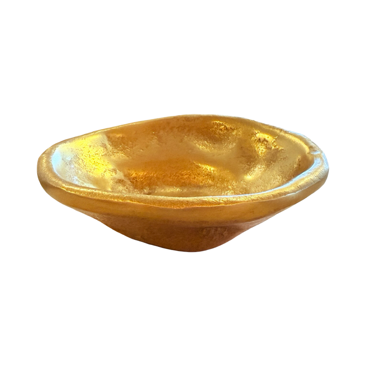 side view of a Free-form dish made of textured gold aluminum with an irregular, organic shape.