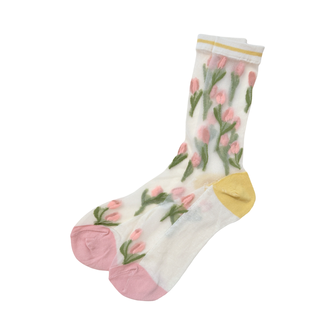 Photo of ivory colored socks decorated with pink tulips, a yellow heel, & pink toebox