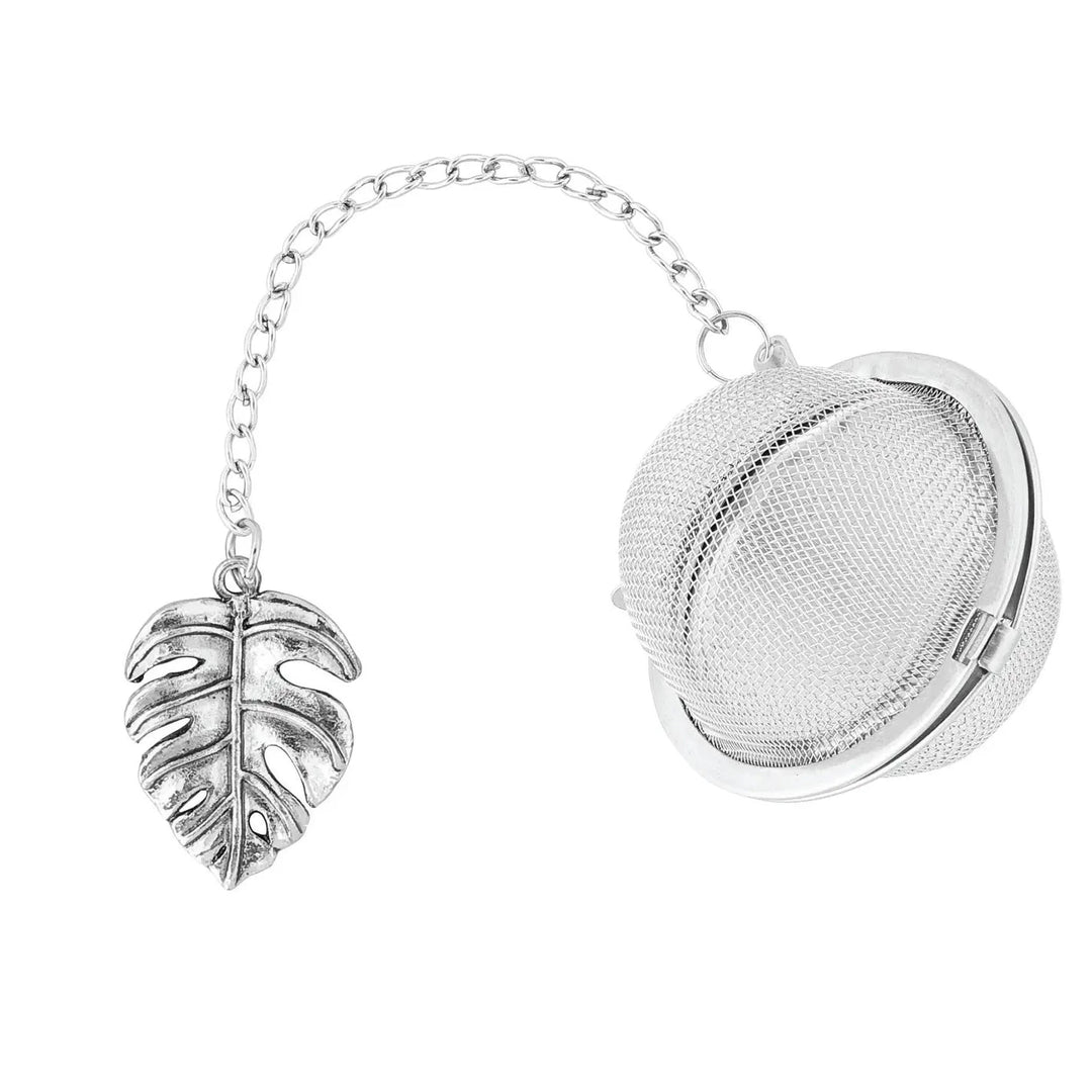 mesh ball tea infuser with a monstera charm