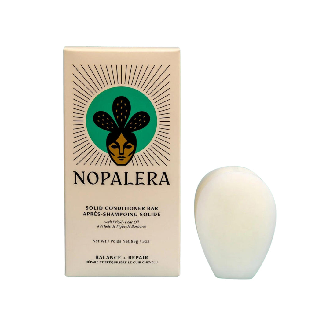 Photo of a paddle shaped solid conditioner bar from the brand, Nopalera
