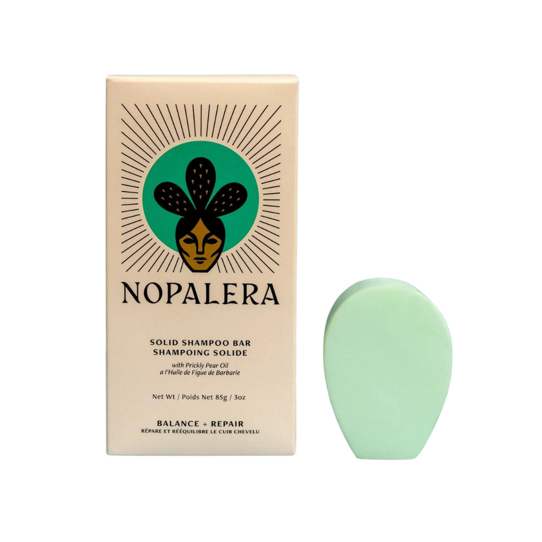 Photo of a paddle shaped solid shampoo bar from the brand, Nopalera