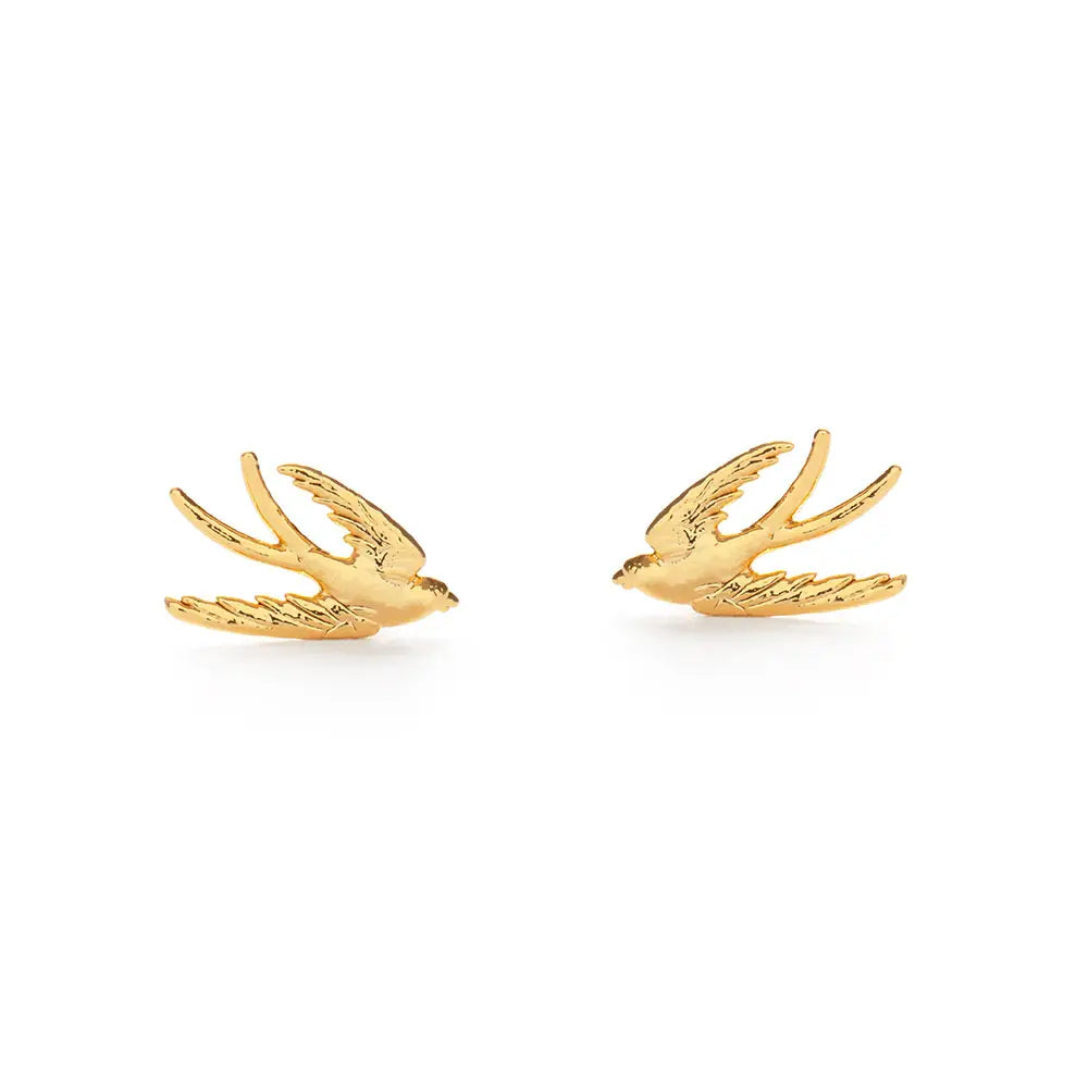 pair of gold-tone swallow bird stud earrings in flight with detailed wings and tails.