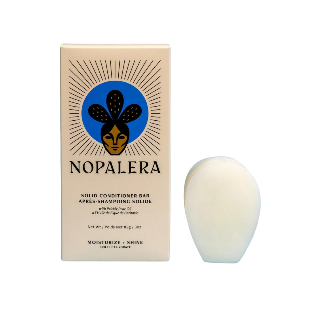 Photo of a paddle shaped solid conditioner bar from the brand, Nopalera