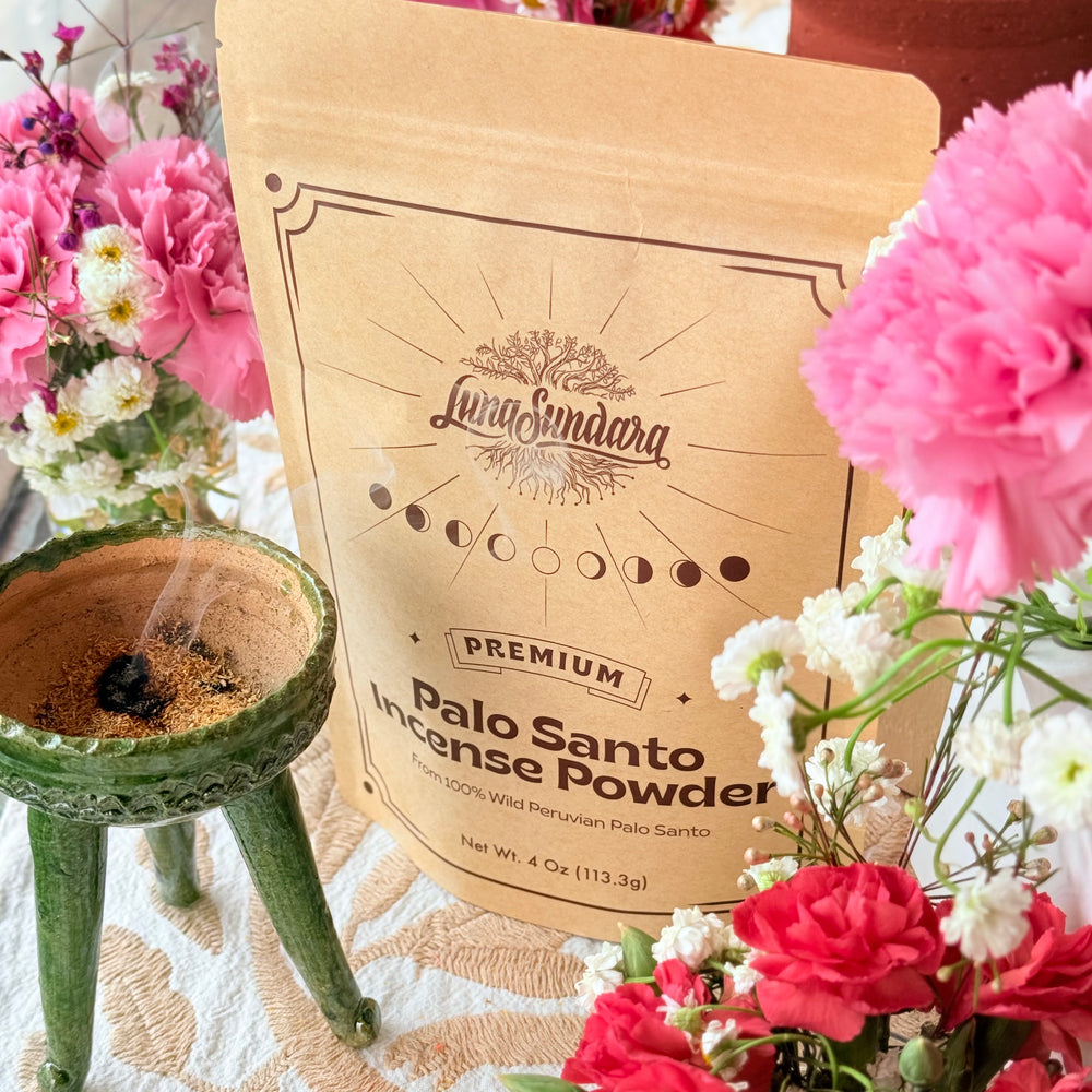 Photo of palo santo incense powder burning inside green copalero