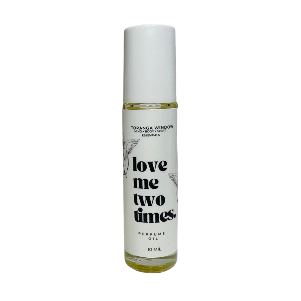 10 mil glass tube of perfume oil with a white branded label. Brand: Topanga Window