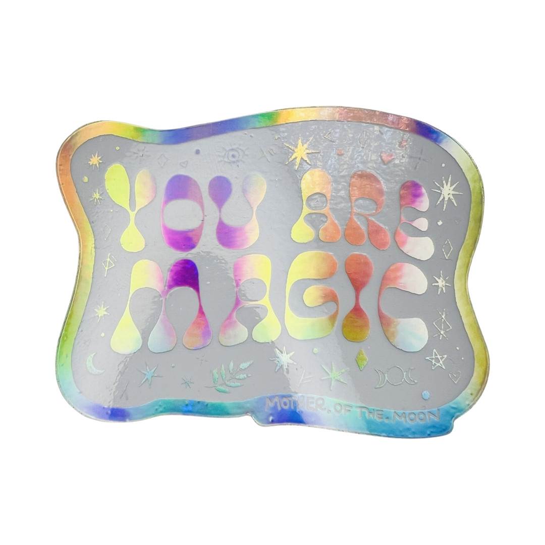 White holographic sticker with the phrase You Are Magic