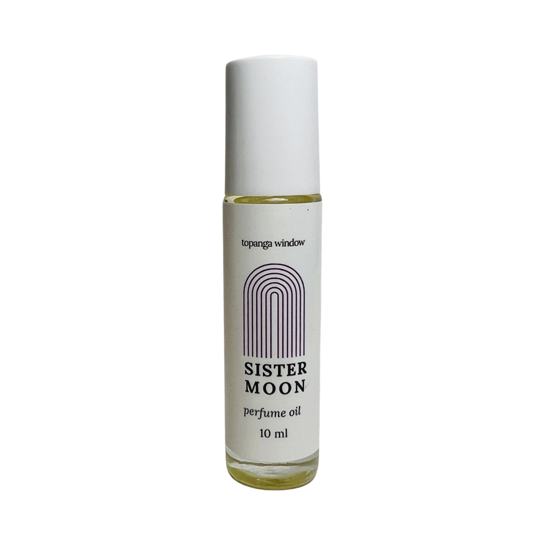 10 mil glass tube of perfume oil with a white branded label. Brand: Topanga Window