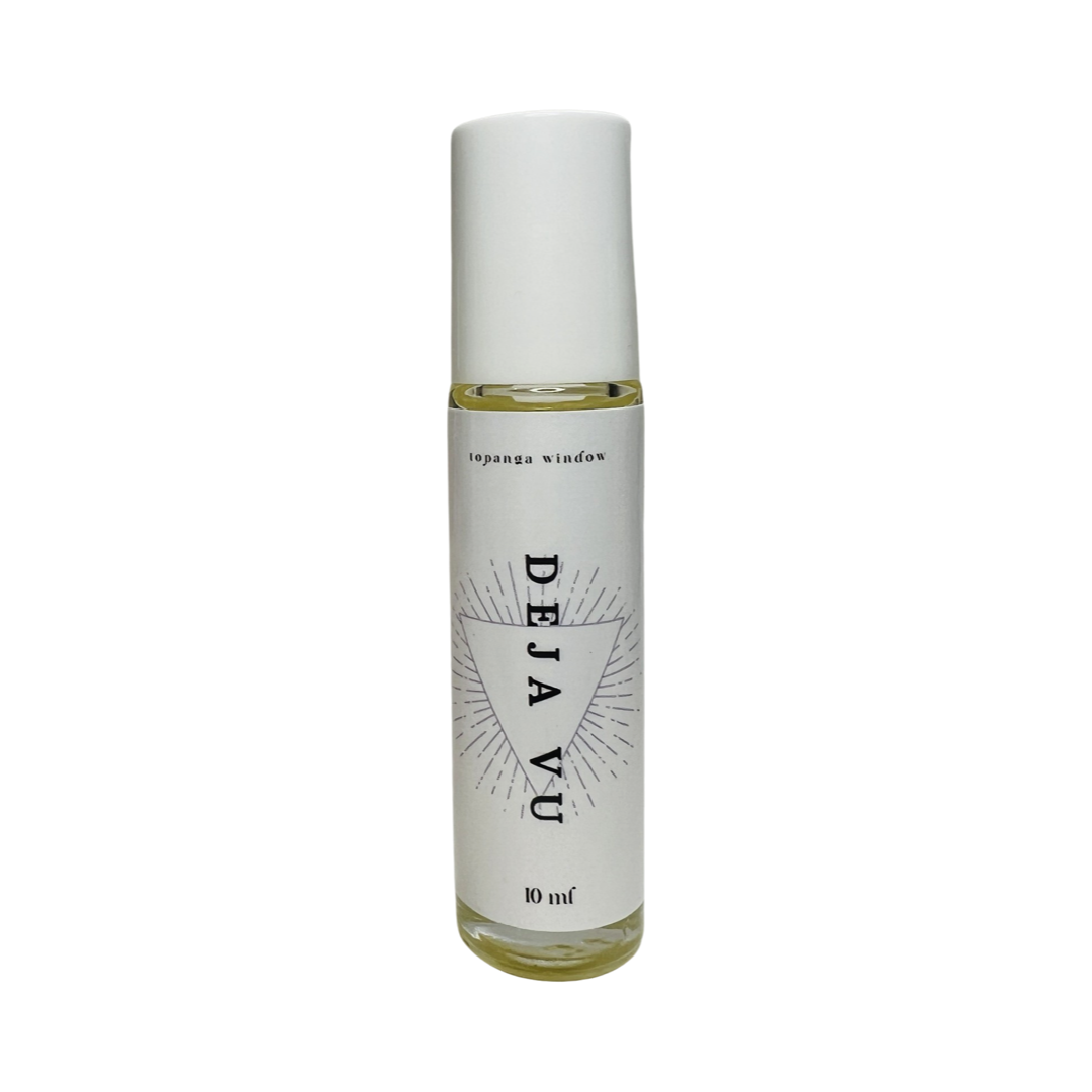 10 mil glass tube of perfume oil with a white branded label. Brand: Topanga Window