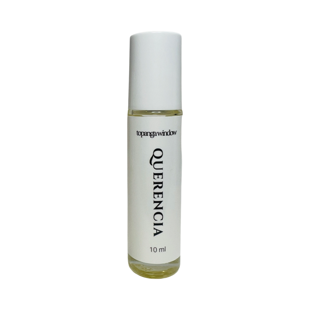 10 mil glass tube of perfume oil with a white branded label. Brand: Topanga Window