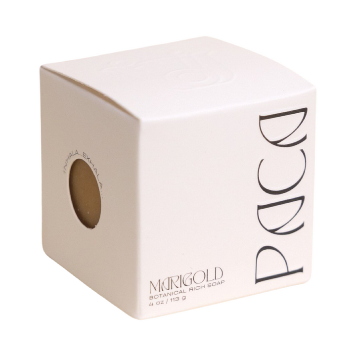 white branded cube shaped box with black lettering. Brand: Paca Botánica