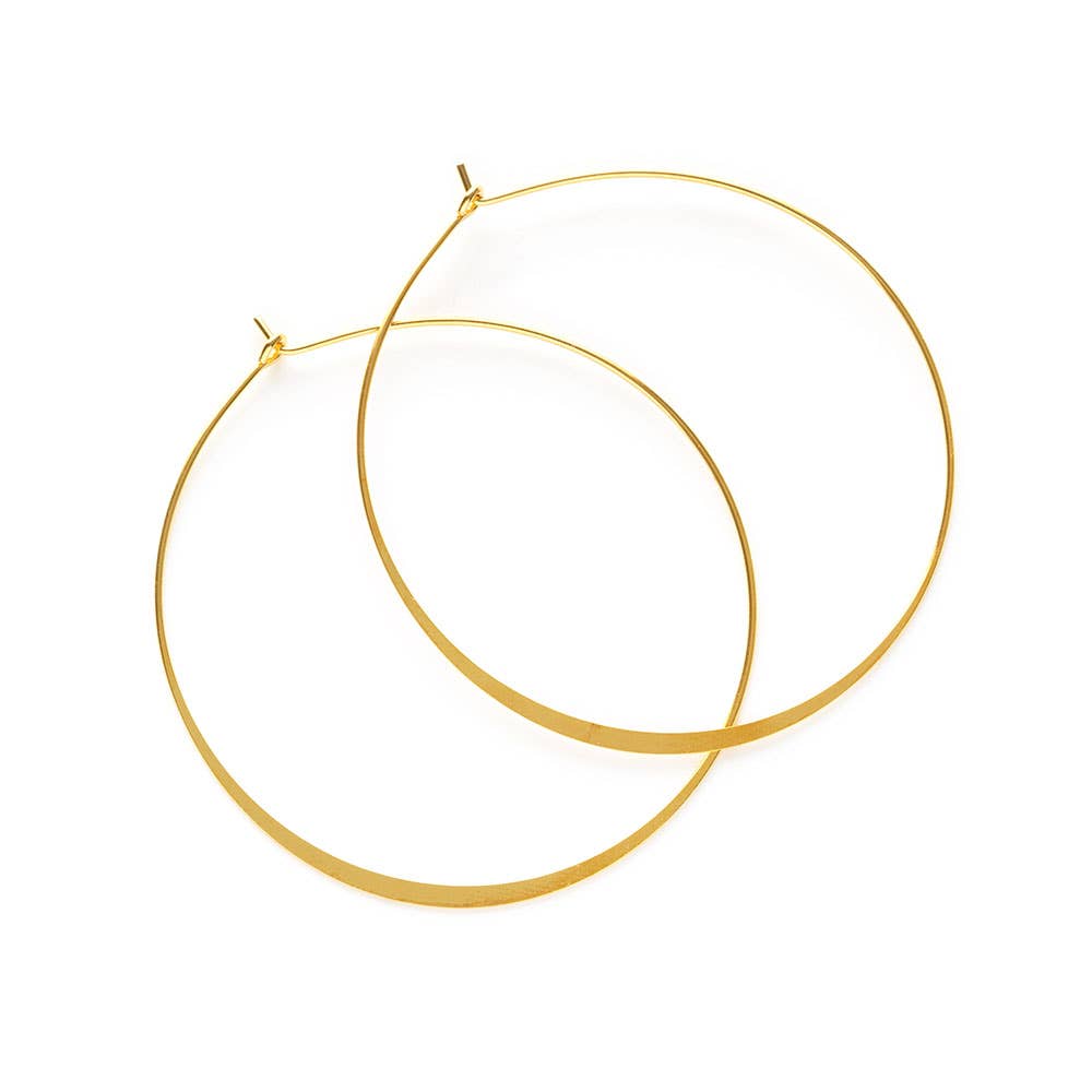 pair of gold hoop earrings. Brand: Amano Studio