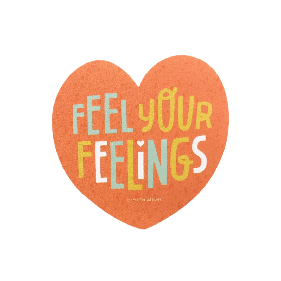 A heart-shaped sticker with the phrase "Feel Your Feelings" in playful, colorful typography on an orange background