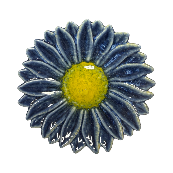 Stoneware flower-shaped dish in dark blue with a yellow center glaze