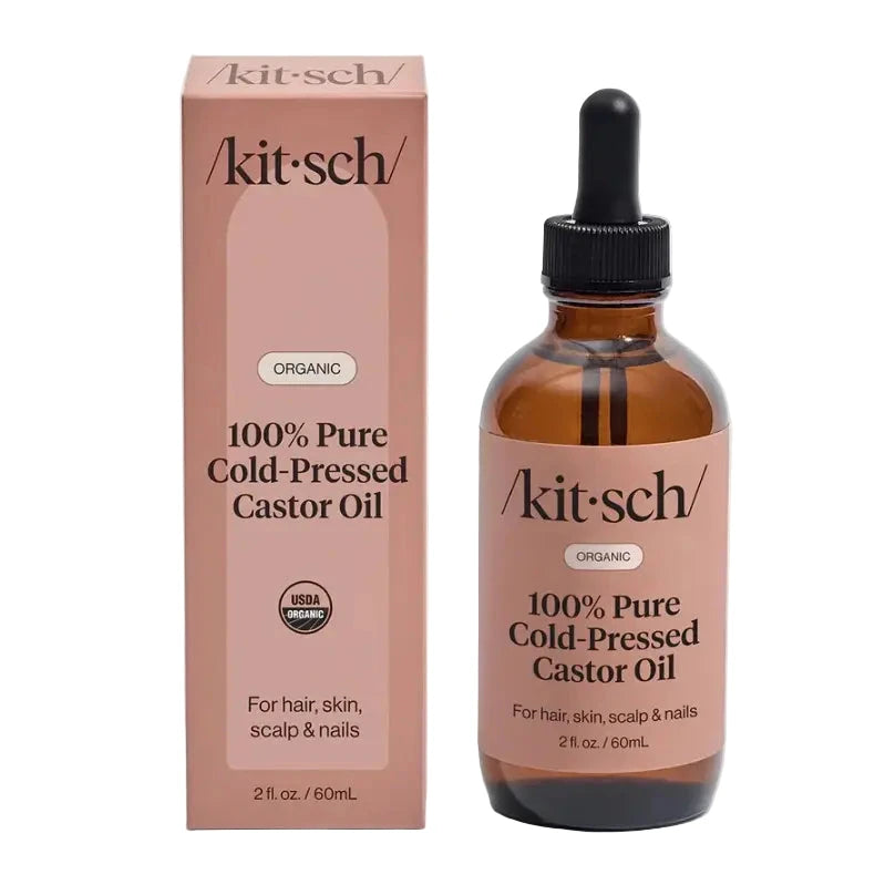 Amber glass dropper bottle and blush box labeled “Kitsch 100% Pure Cold-Pressed Castor Oil – Organic, for hair, skin, scalp & nails.