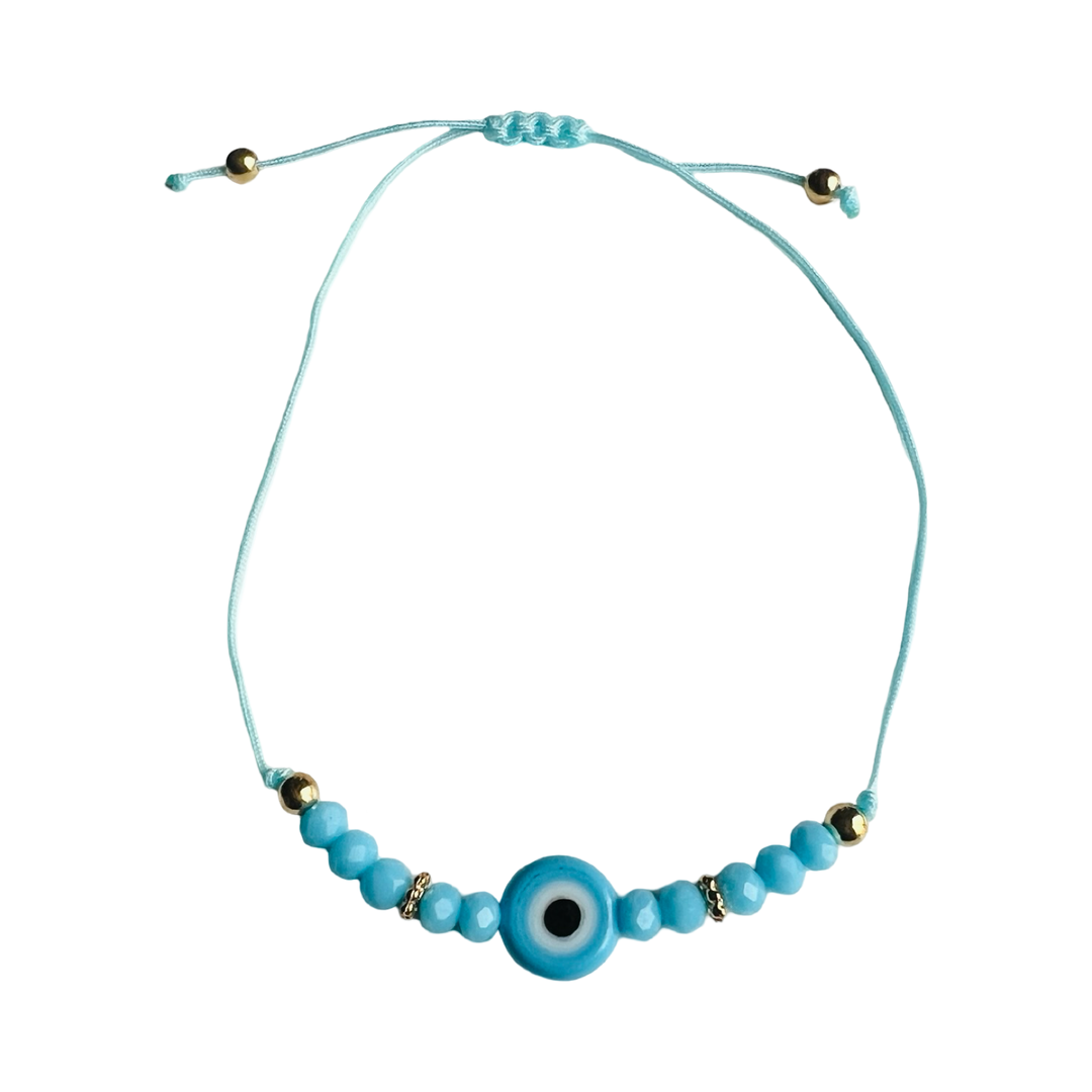 Turquoise bead bracelet with a turquoise evil eye charm and gold beads