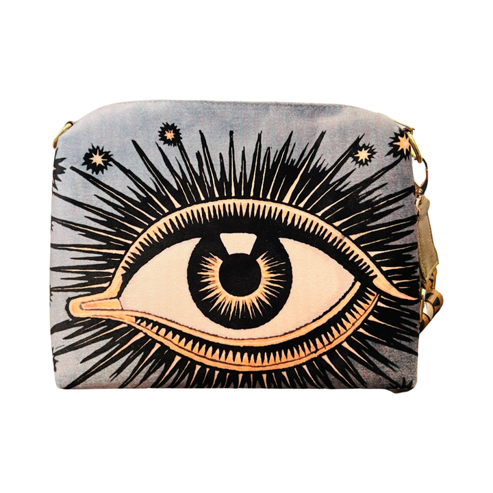 gray bag with an image of an eye featuring eyelashes and stars